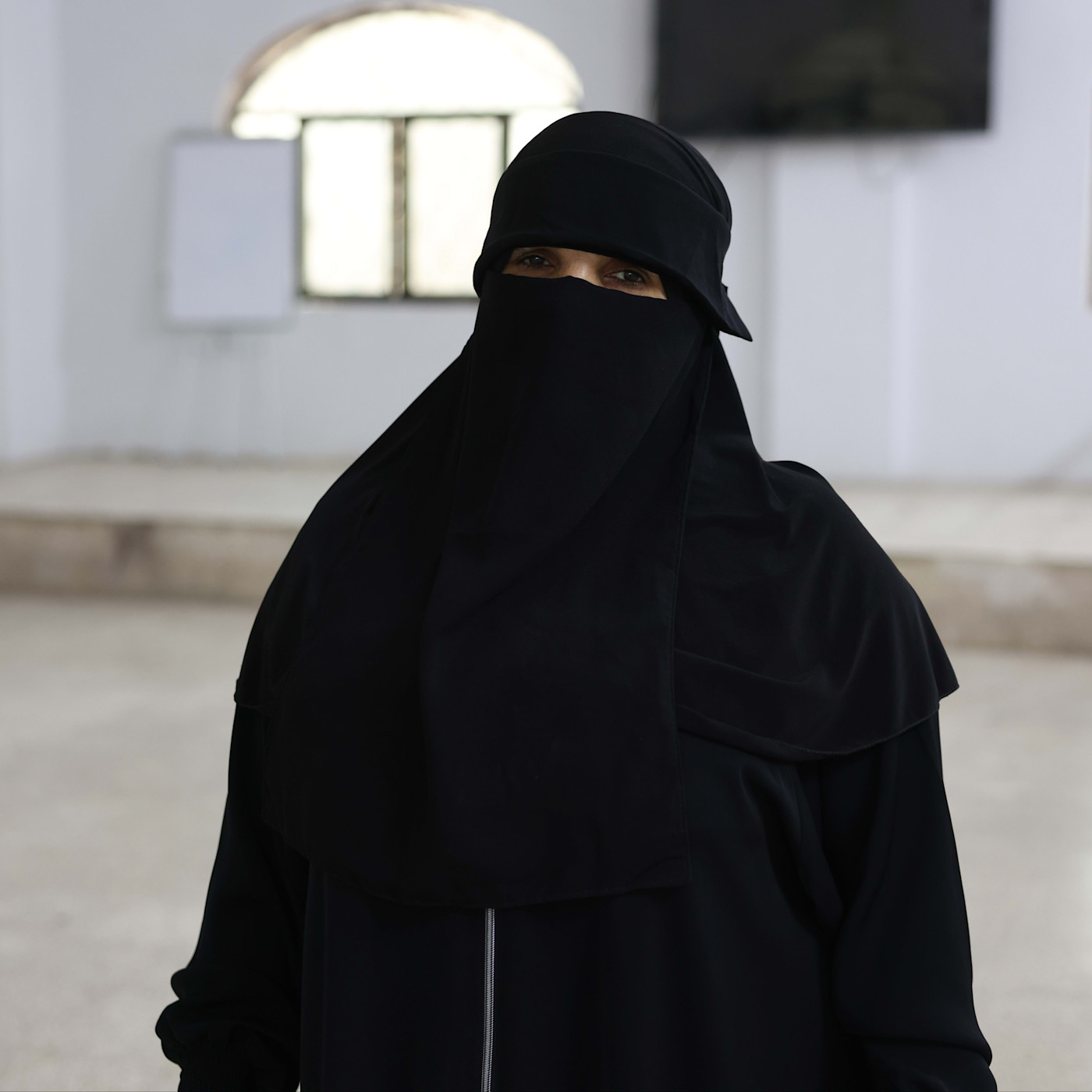 A woman in a black hijab